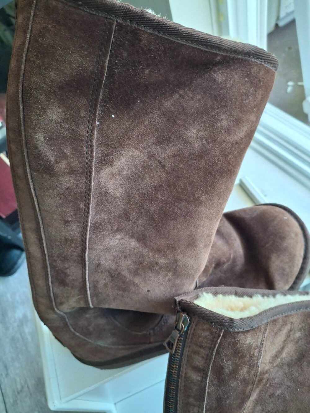 Uggs taller boots brown suede and sheepskin lined.